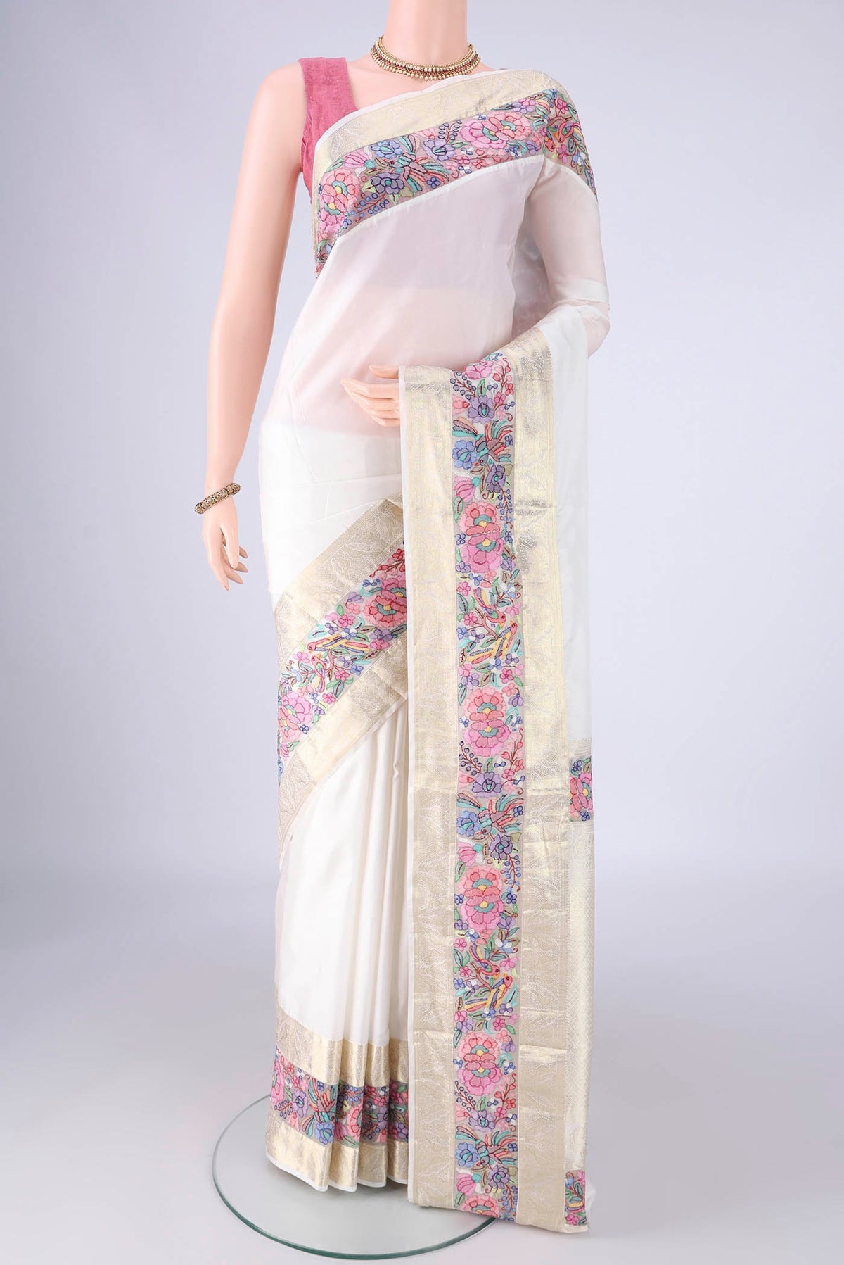 White Kanjivaram Silk Saree with Plain Body and Zari Border.  displayed on a mannequin