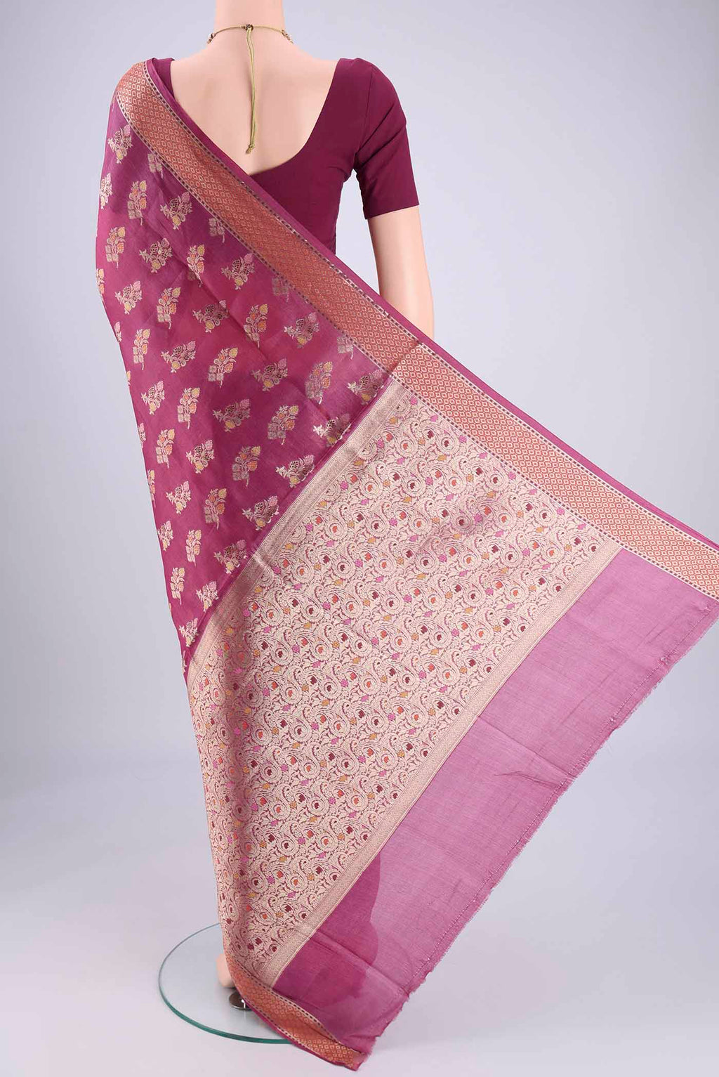 Flat view of Magenta Banarasi Tussar Silk Saree with Zari And Thread Butta on the body and Zari And Thread Border. 