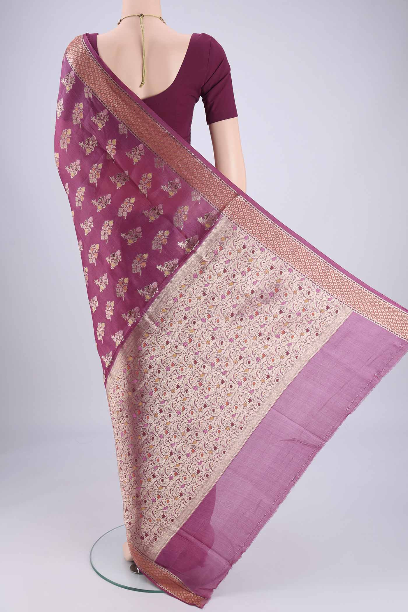 Flat view of Magenta Banarasi Tussar Silk Saree with Zari And Thread Butta on the body and Zari And Thread Border. 