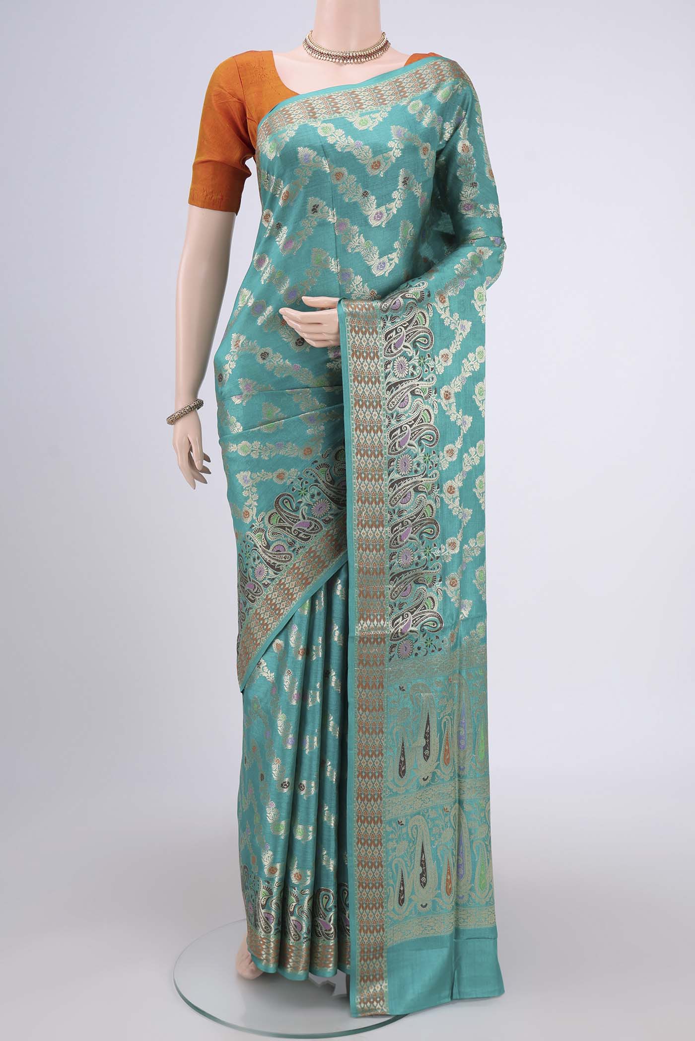 Sea Green Banarasi Tussar Silk Saree with Zari Brocade on the body and Zari And Thread Border.  displayed on a mannequin