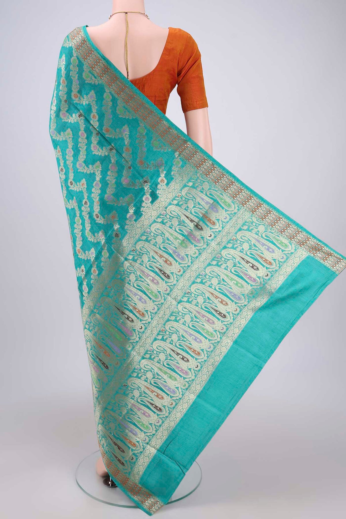 Flat view of Sea Green Banarasi Tussar Silk Saree with Zari Brocade on the body and Zari And Thread Border. 