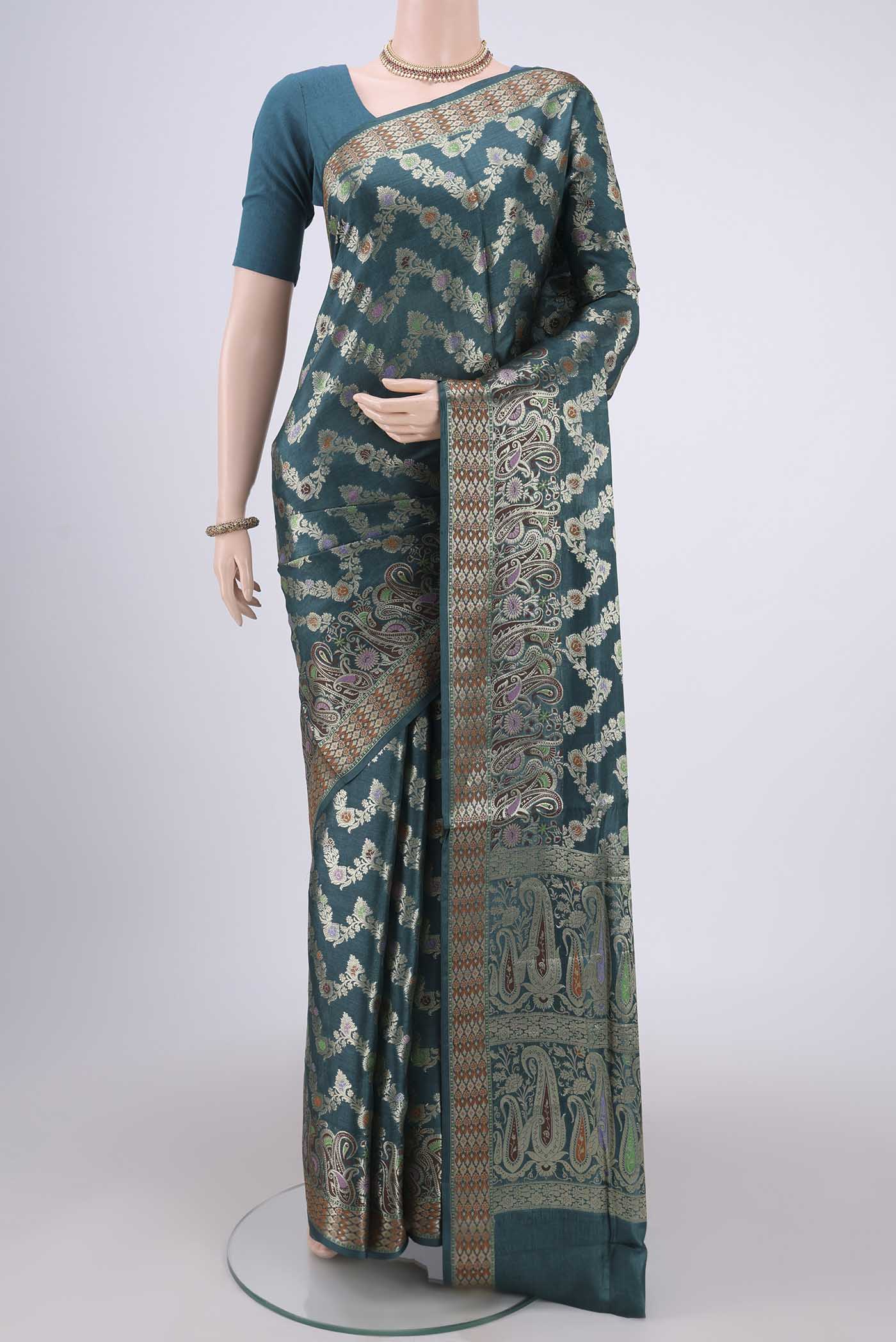 Sea Green Banarasi Raw Silk Saree with Zari Brocade on the body and Zari And Thread Border.  displayed on a mannequin