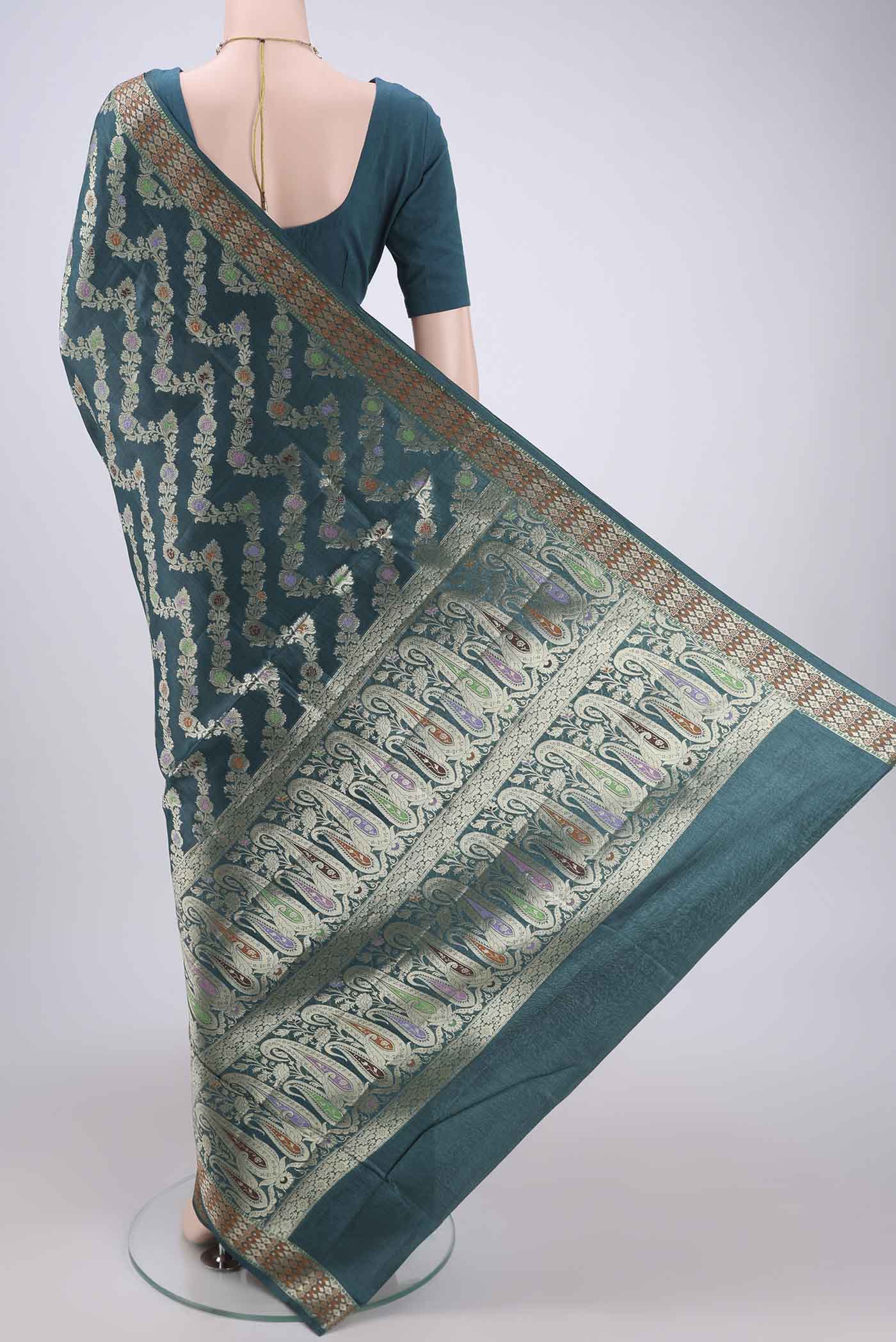 Flat view of Sea Green Banarasi Raw Silk Saree with Zari Brocade on the body and Zari And Thread Border. 