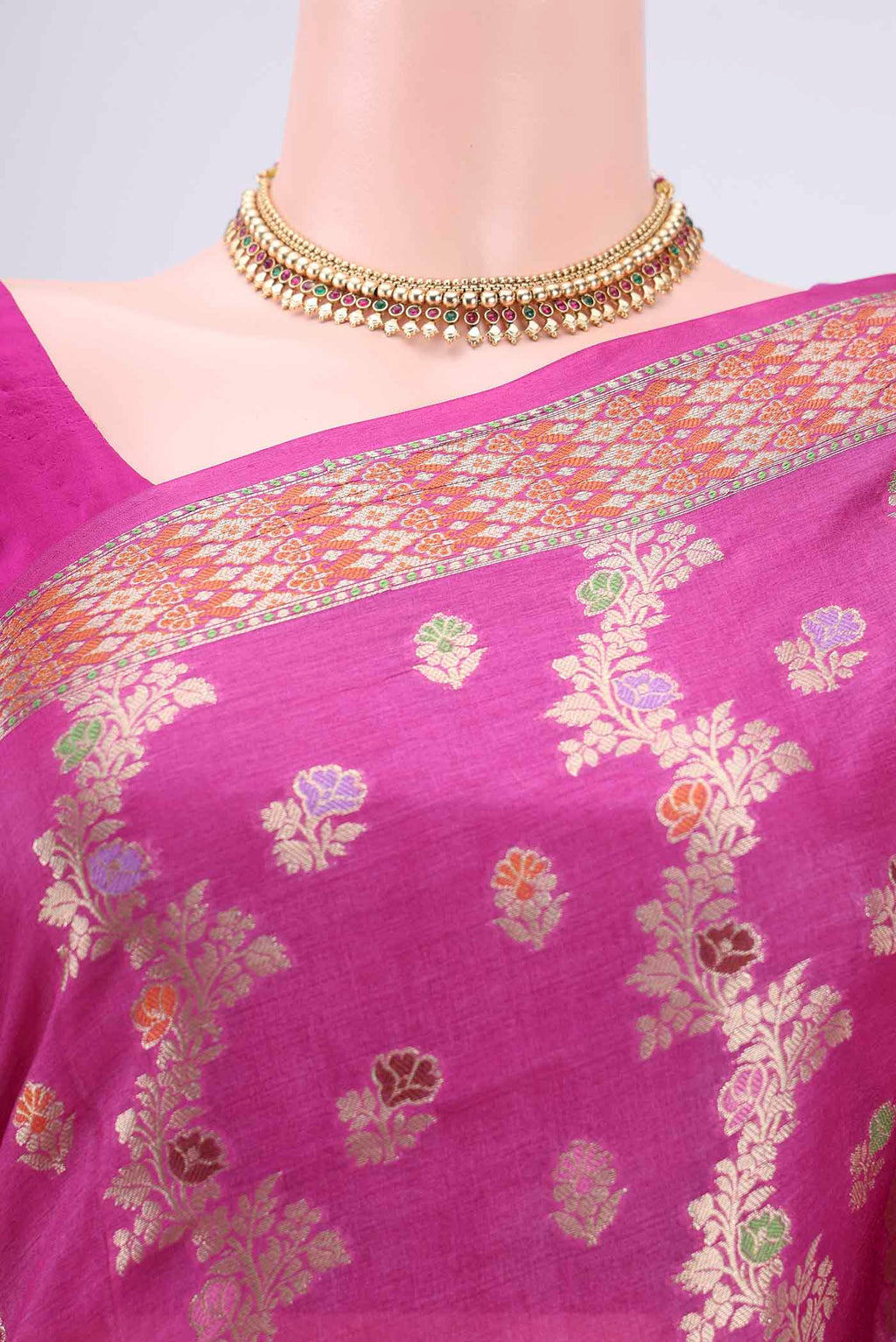 Border image of Rani Pink Banarasi Raw Silk Saree with Zari Brocade on the body and Zari And Thread Border. 