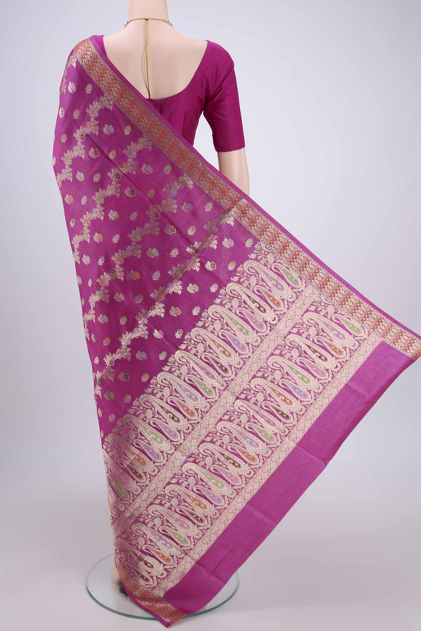 Flat view of Rani Pink Banarasi Raw Silk Saree with Zari Brocade on the body and Zari And Thread Border. 