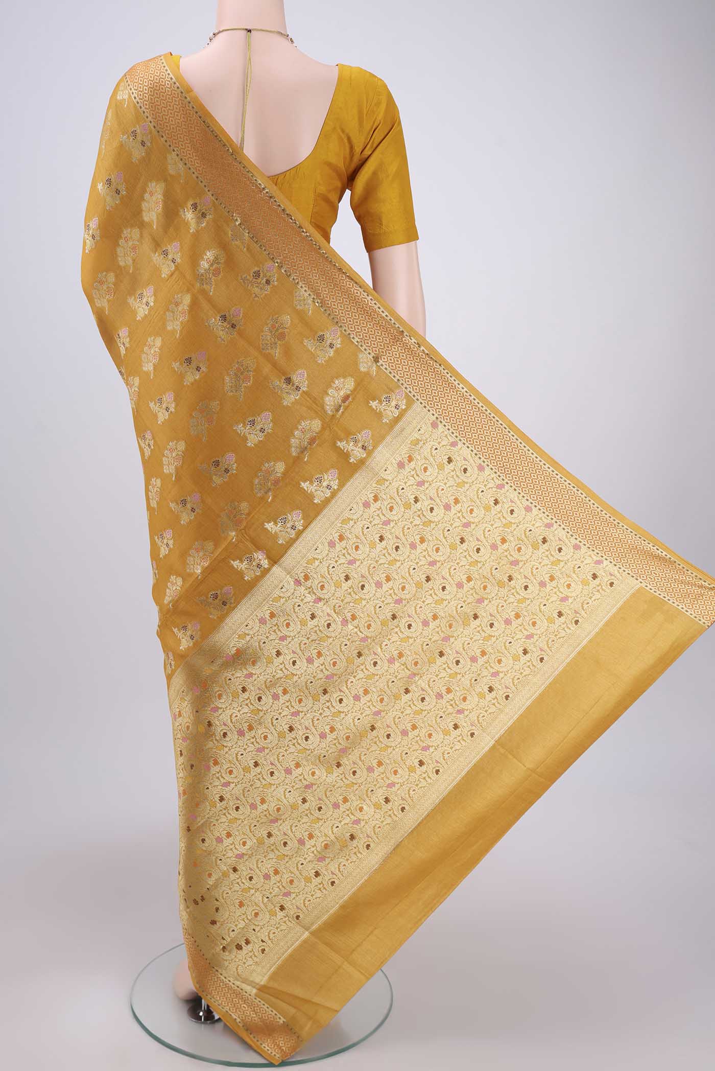 Flat view of Mustard Banarasi Raw Silk Saree with Zari And Thread Butta on the body and Zari And Thread Border. 