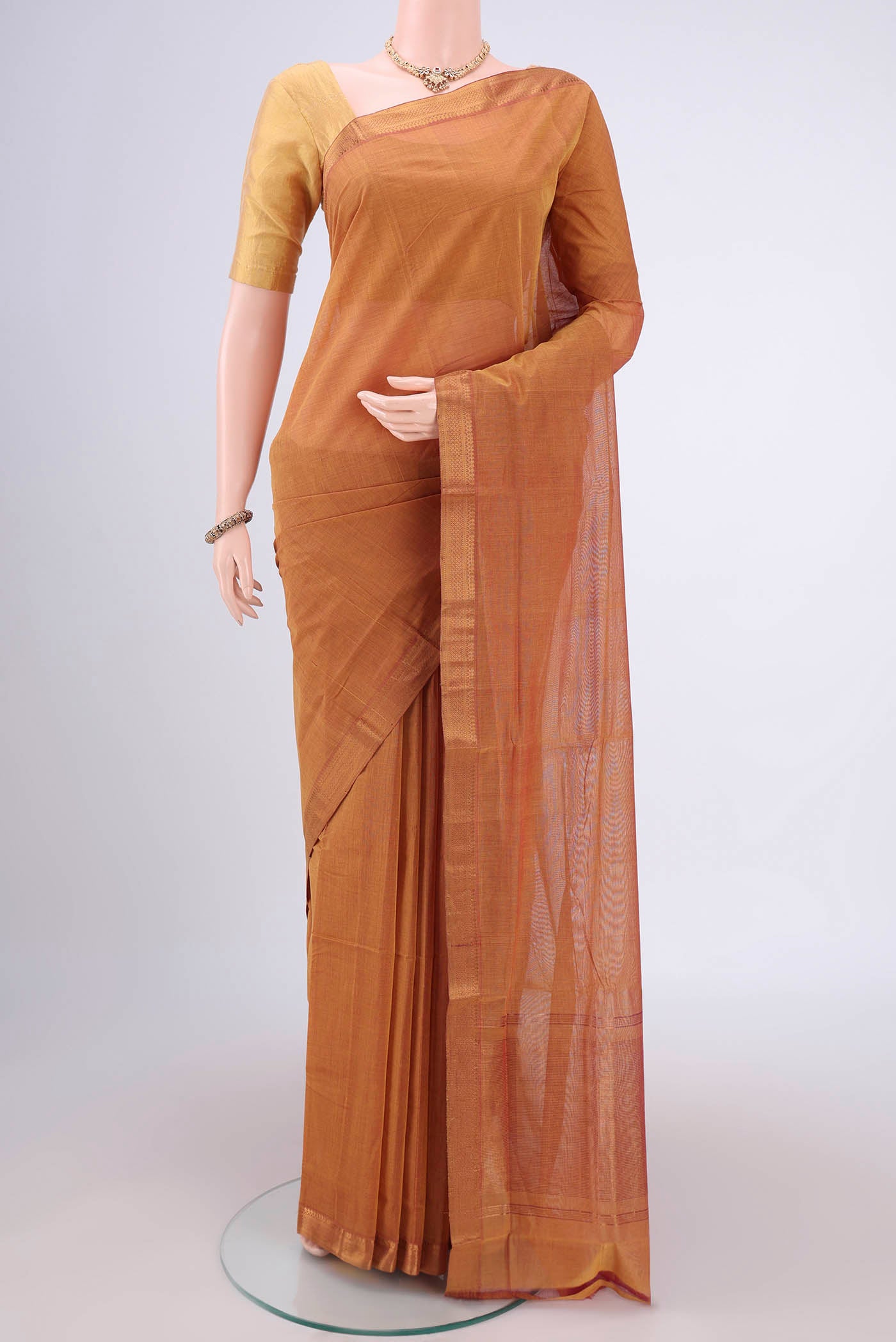 Mustard Mangalagiri Cotton Saree with Plain Body and Zari Border.  displayed on a mannequin
