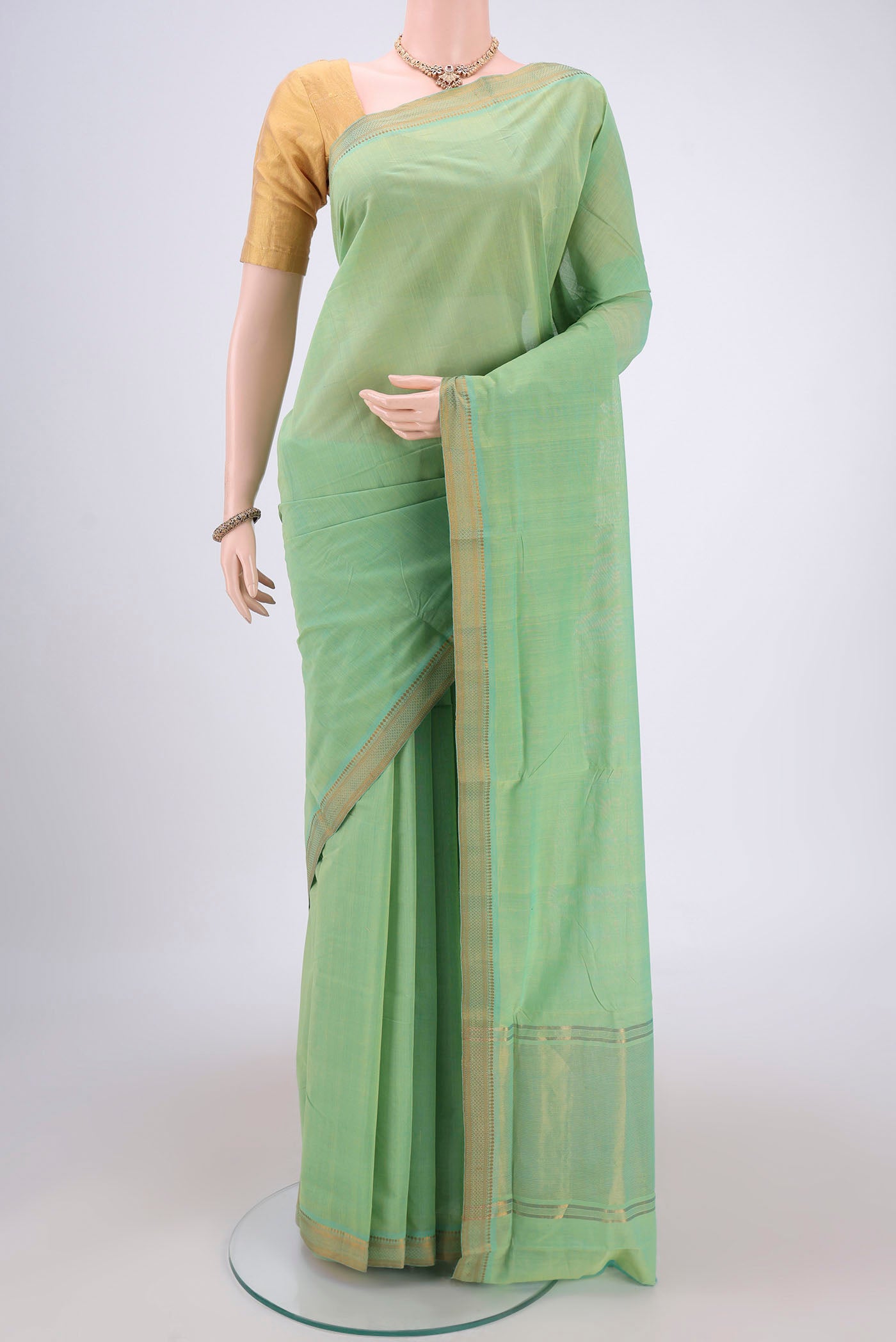 Acid Green Mangalagiri Cotton Saree with Plain Body and Zari Border.  displayed on a mannequin