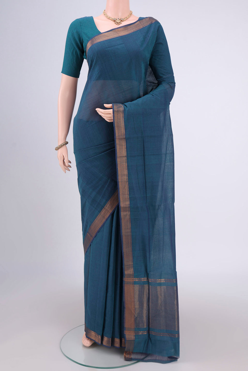 Peacock Blue Mangalagiri Cotton Saree with Plain Body and Zari Border.  displayed on a mannequin