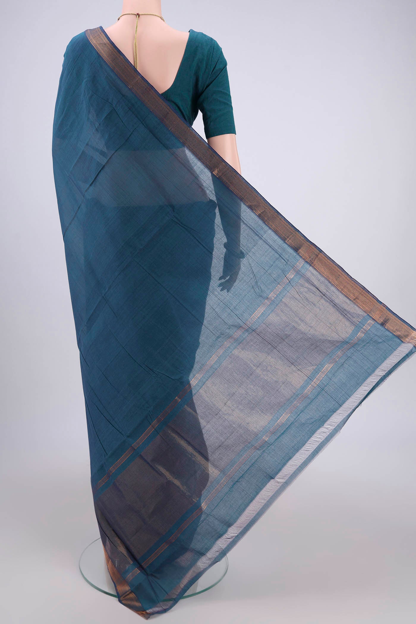 Flat view of Peacock Blue Mangalagiri Cotton Saree with Plain Body and Zari Border. 