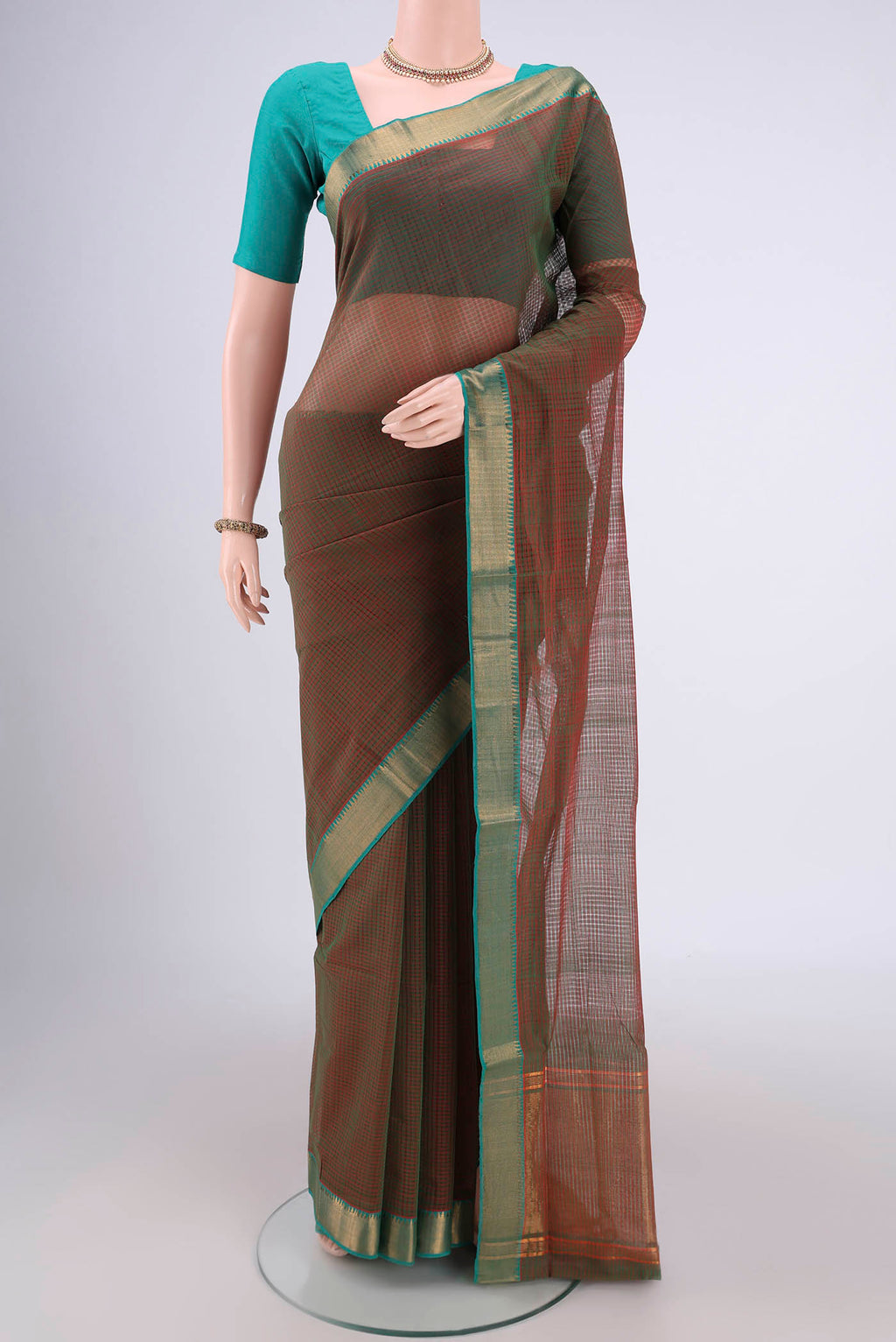 Green Mangalagiri Cotton Saree with Plain Body and Zari Border.  displayed on a mannequin