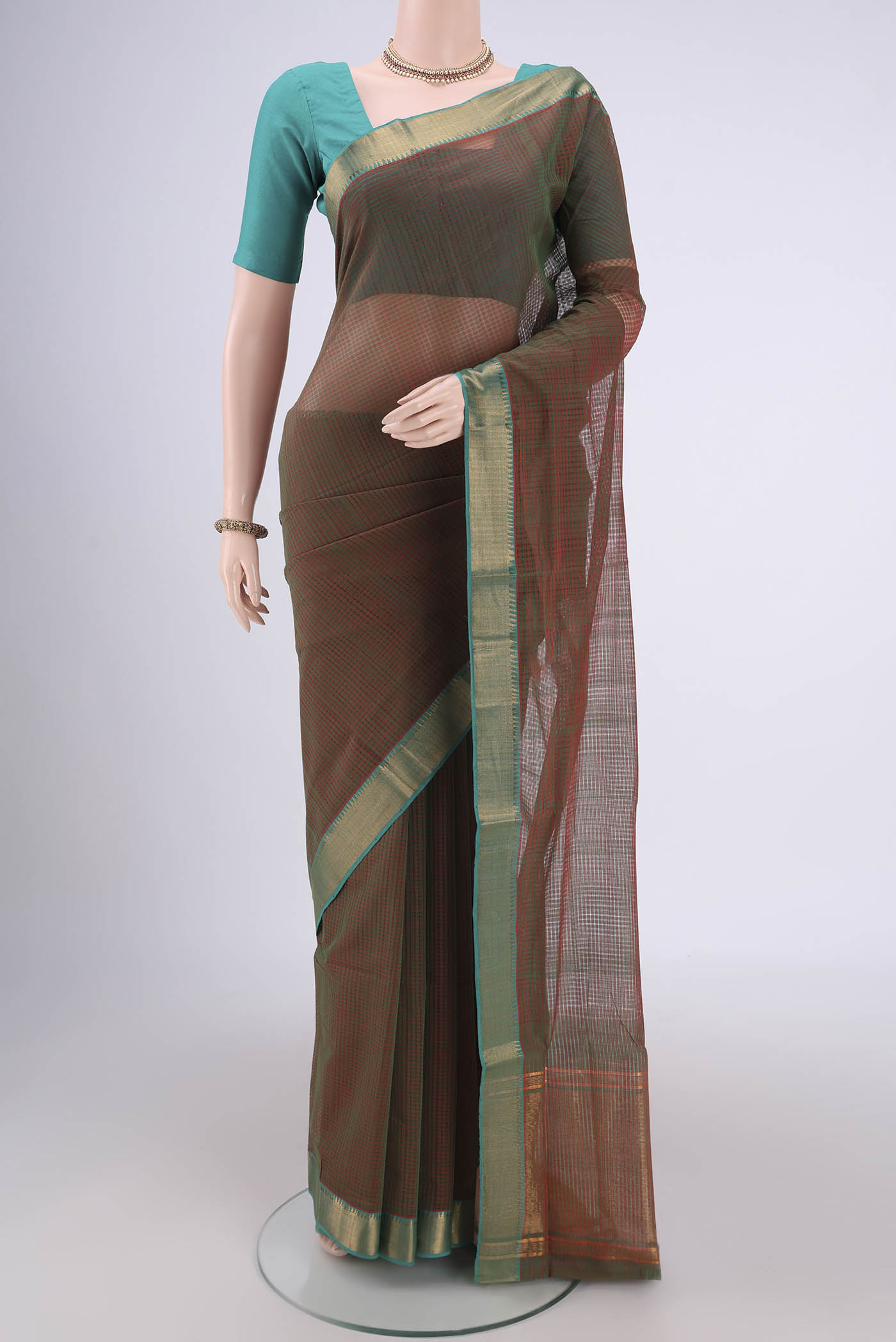 Green Mangalagiri Cotton Saree with Plain Body and Zari Border.  displayed on a mannequin