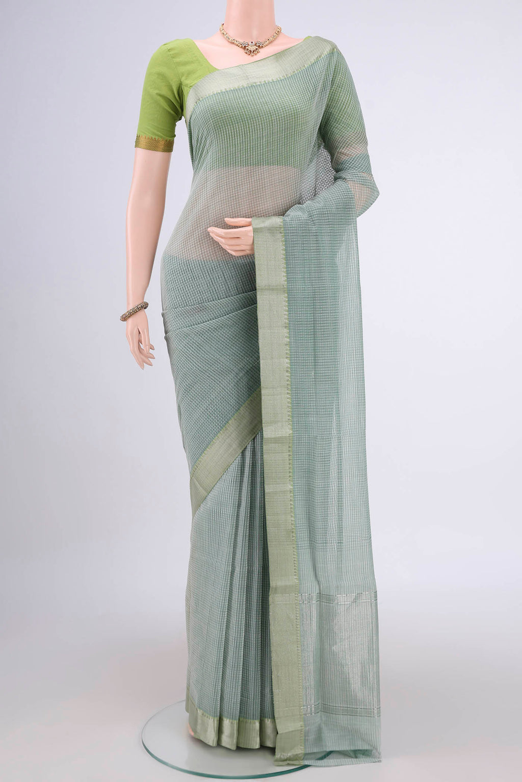 Sage Green Mangalagiri Cotton Saree with Plain Body and Zari Border.  displayed on a mannequin