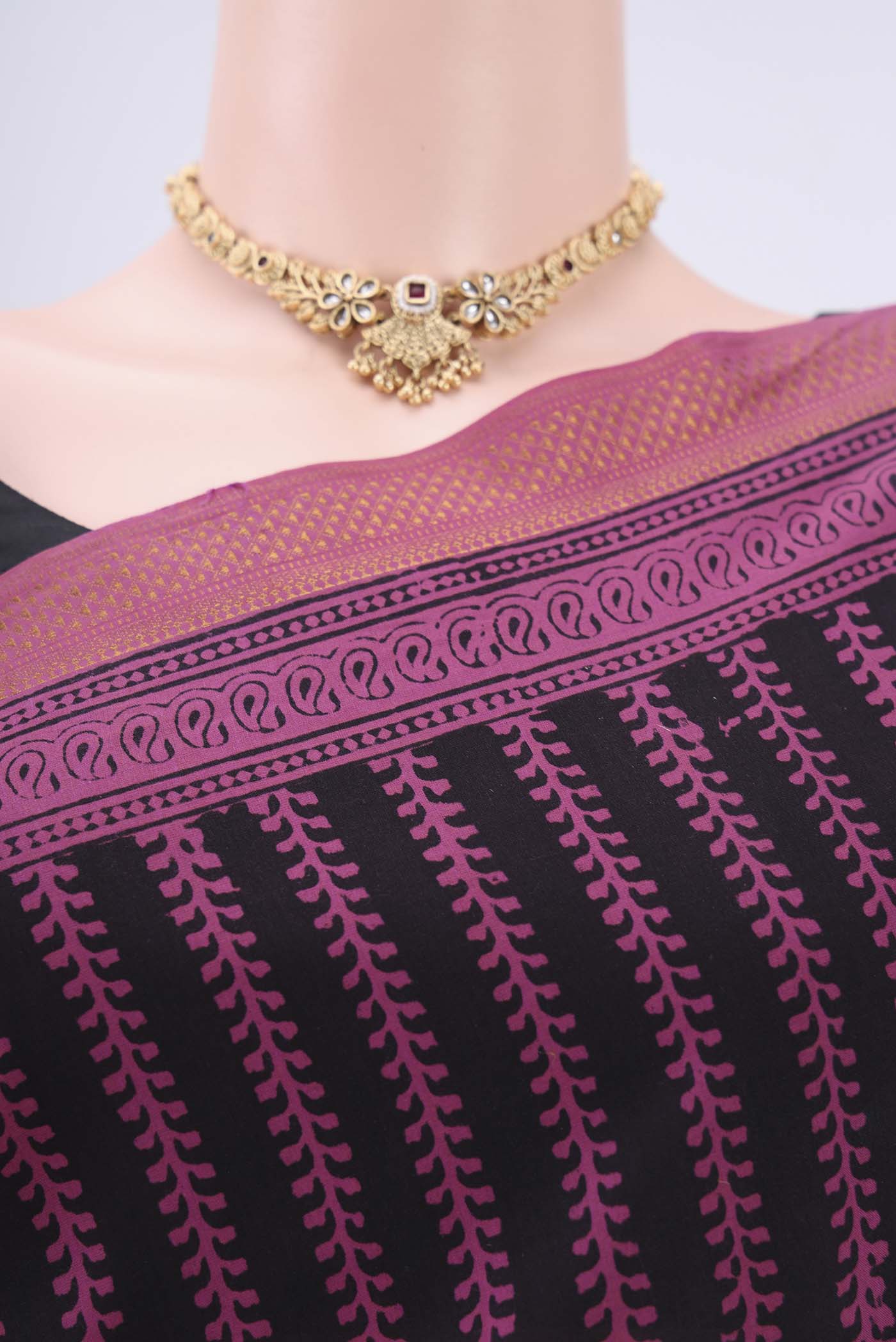 Border image of Black Maheshwari Silk Cotton Saree with Stripes on the body and Zari Border. 