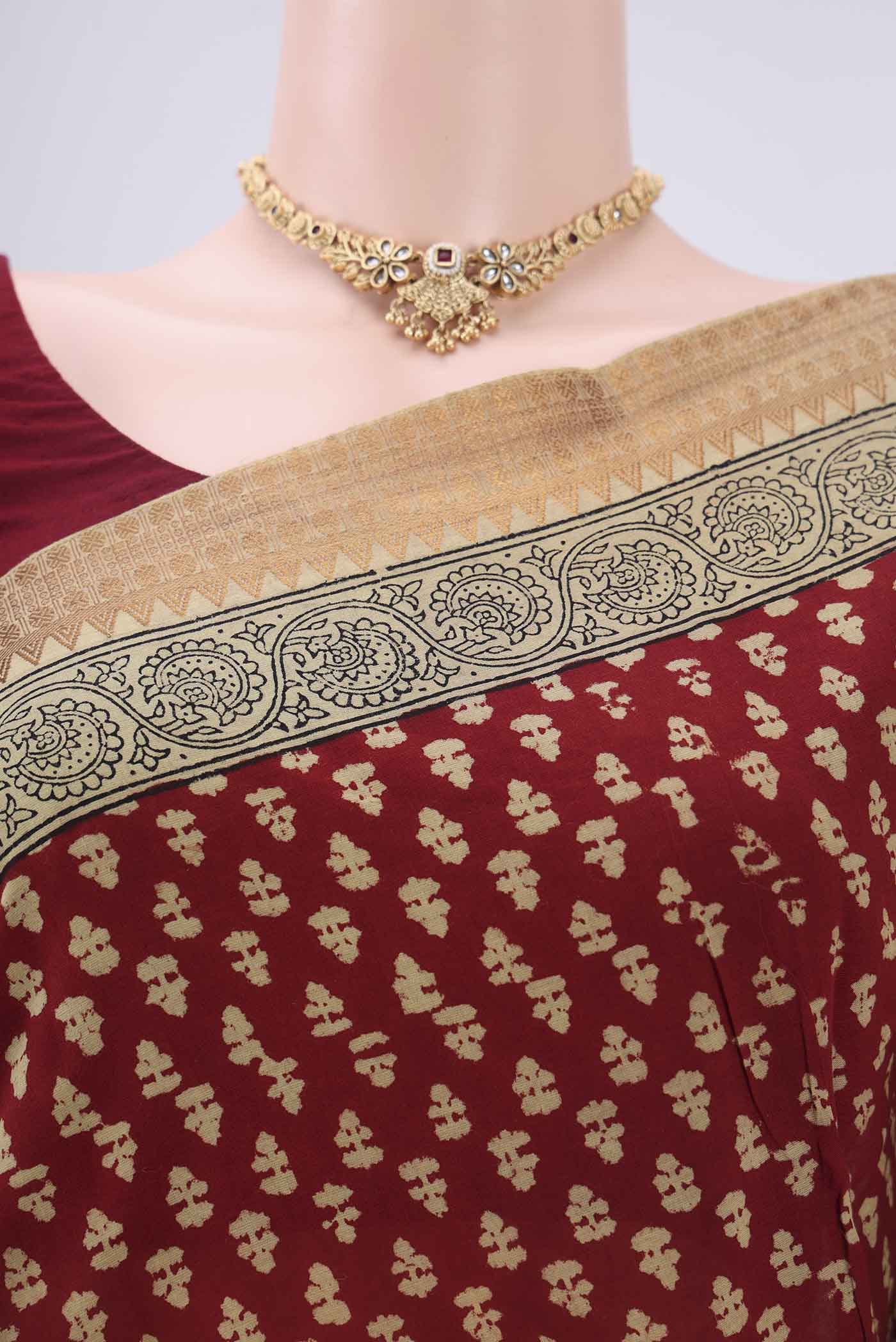Border image of Maroon Maheshwari Silk Cotton Saree with Stripes on the body and Zari Border. 