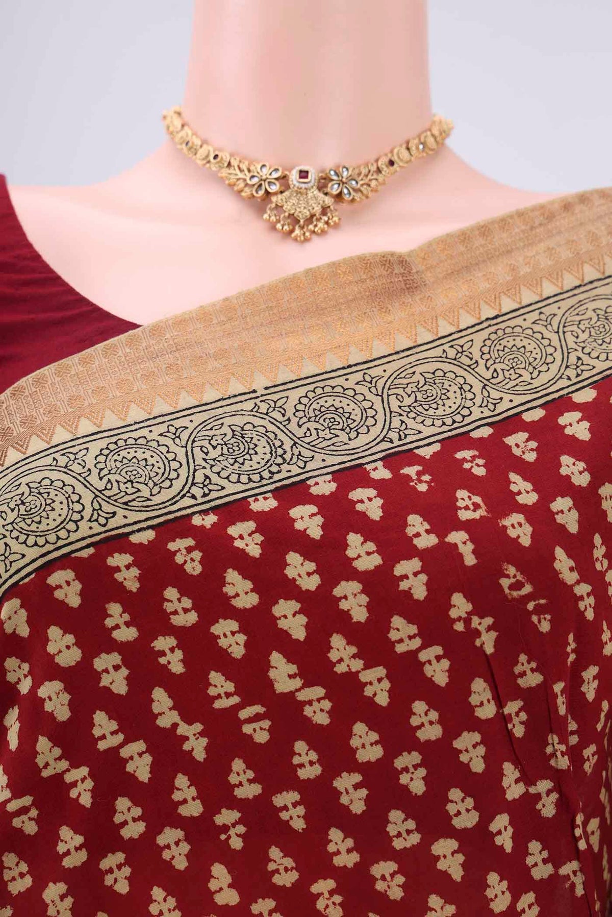 Border image of Maroon Maheshwari Silk Cotton Saree with Stripes on the body and Zari Border. 