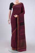 Light Magenta Maheshwari Silk Cotton Saree with Batik Print on the body and Zari Border.  displayed on a mannequin