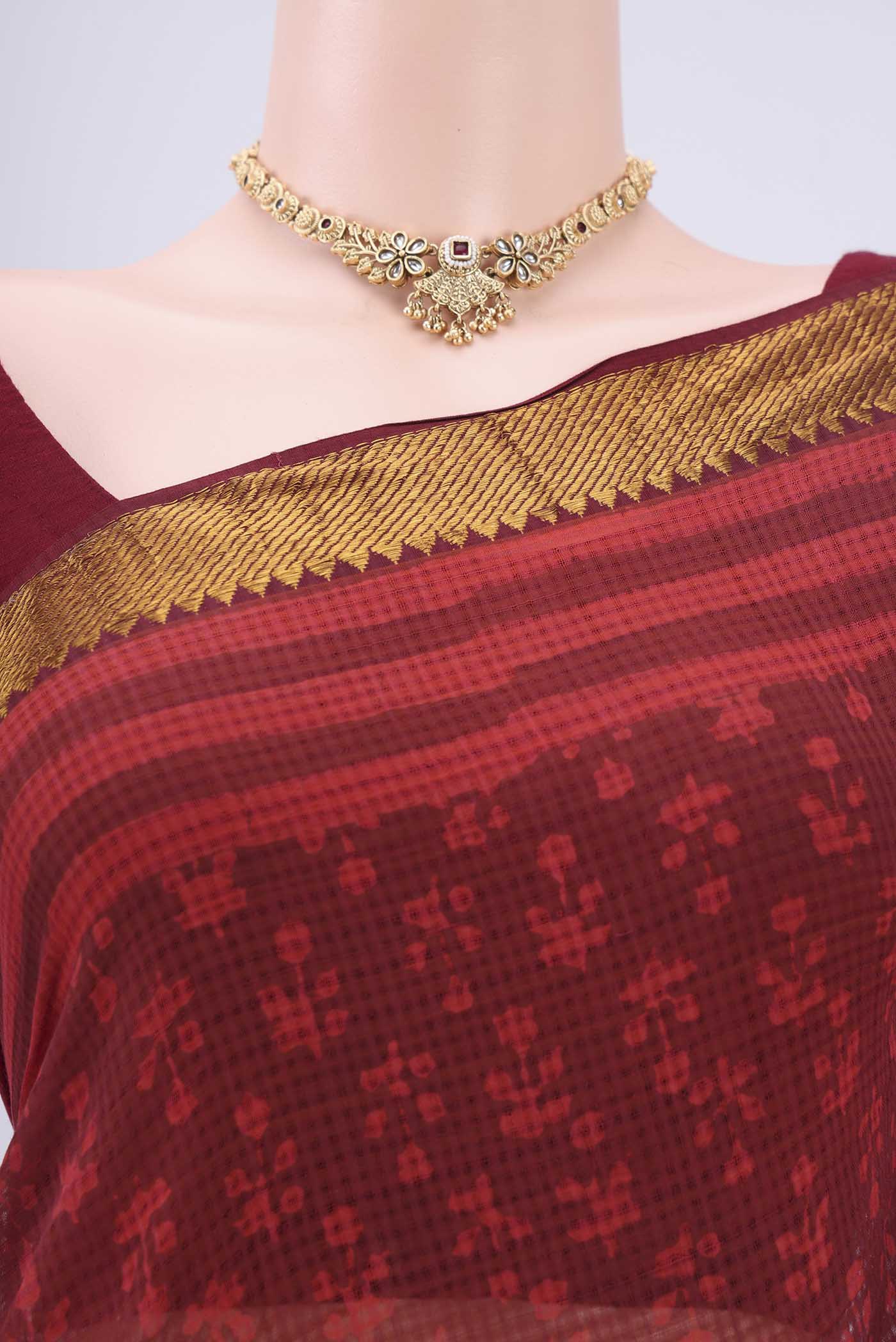 Border image of Red Maheshwari Silk Cotton Saree with Batik Print on the body and Zari Border. 