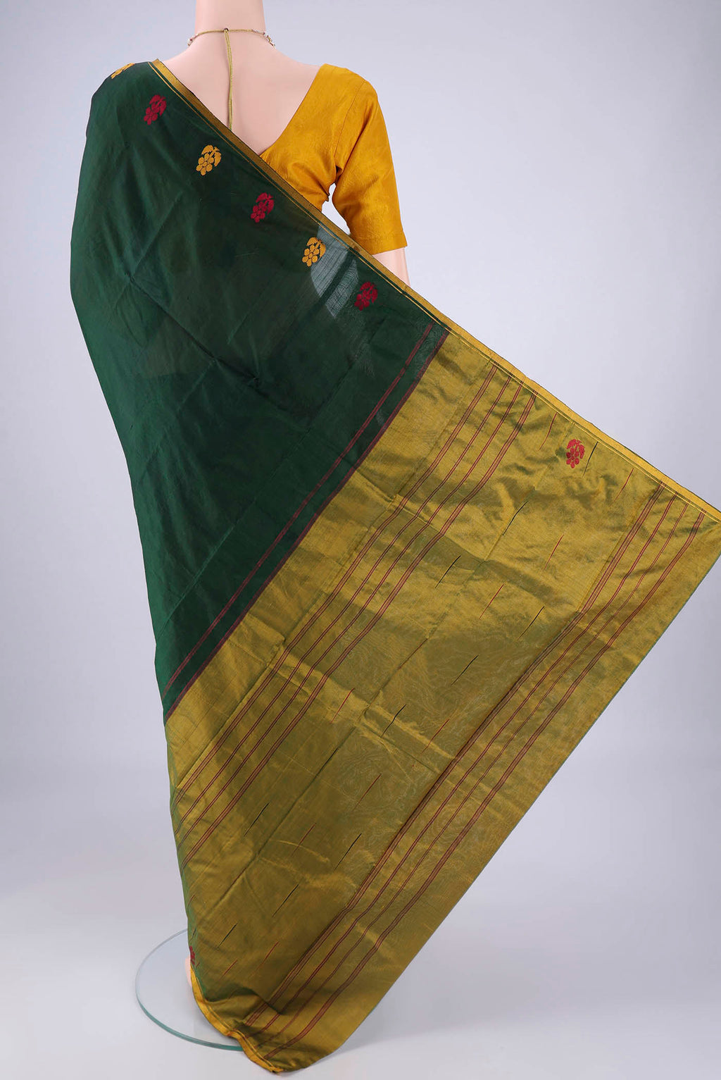 Flat view of Bottle Green Kanchipuram Silk Saree with Plain Body and Thread Border. 