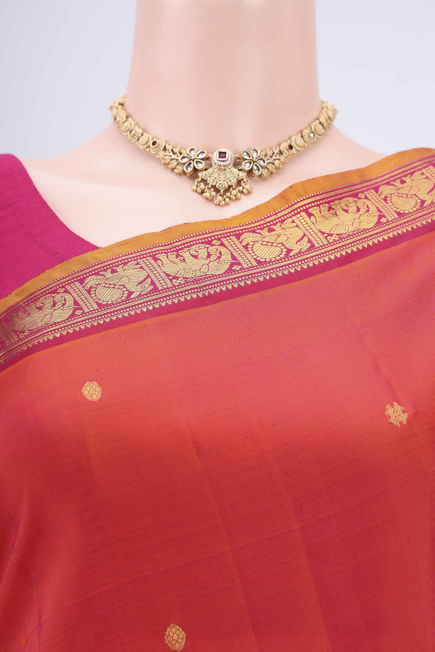 Border image of Orange Kanchipuram Silk Saree with Plain Body and Zari Border. 