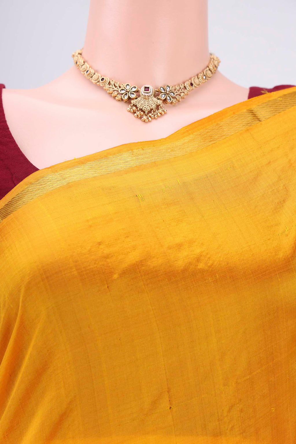 Border image of Mustard Kanchipuram Silk Saree with Plain Body and Thread Border. 