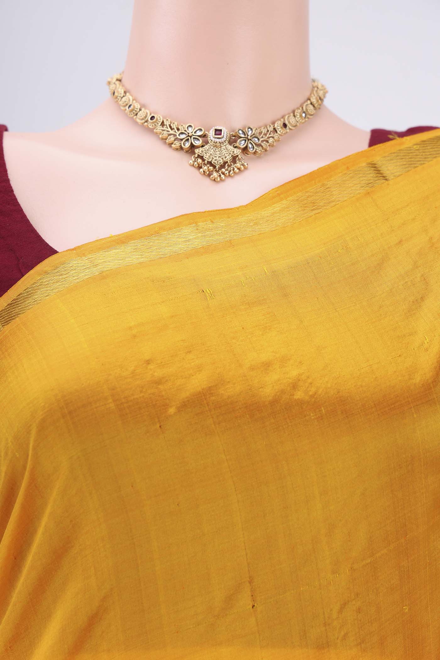 Border image of Mustard Kanchipuram Silk Saree with Plain Body and Thread Border. 