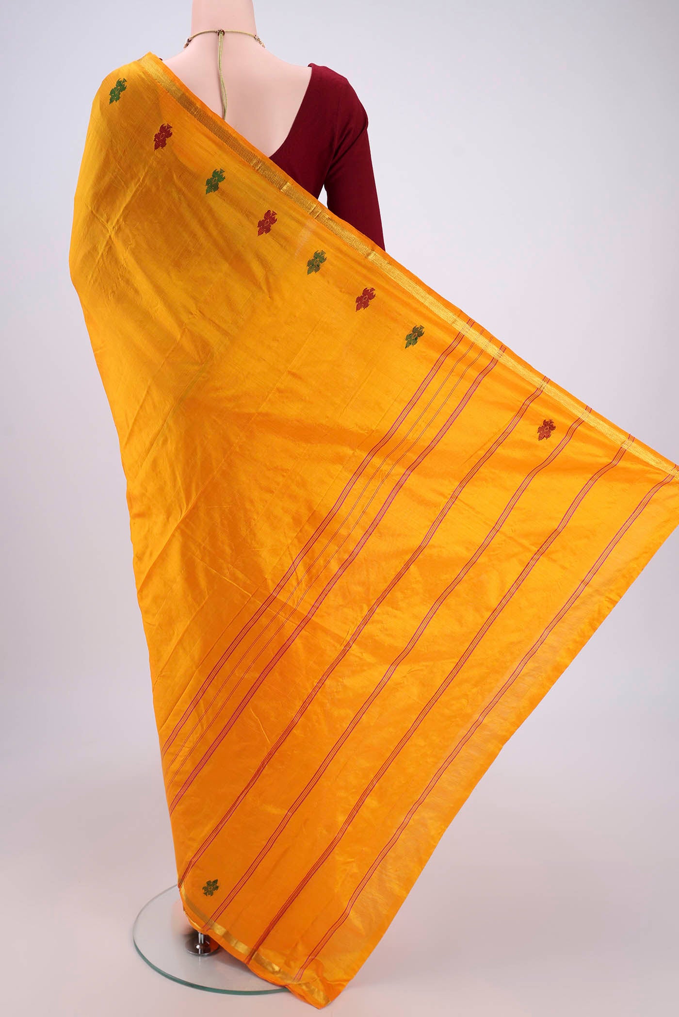 Flat view of Mustard Kanchipuram Silk Saree with Plain Body and Thread Border. 