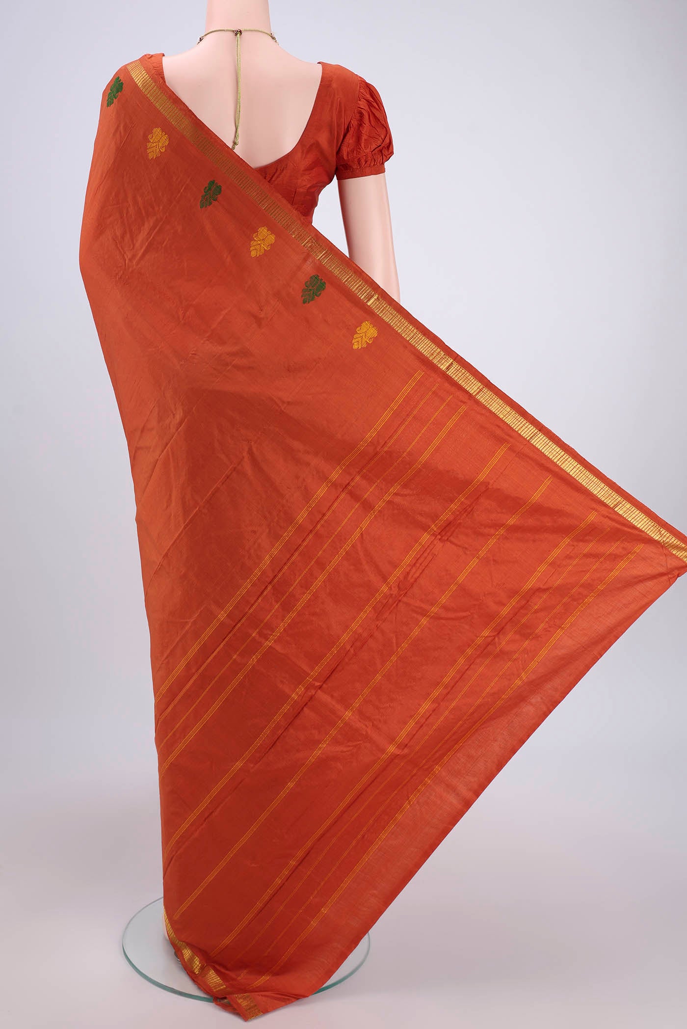 Flat view of Rust Kanchipuram Silk Saree with Plain Body and Thread Border. 