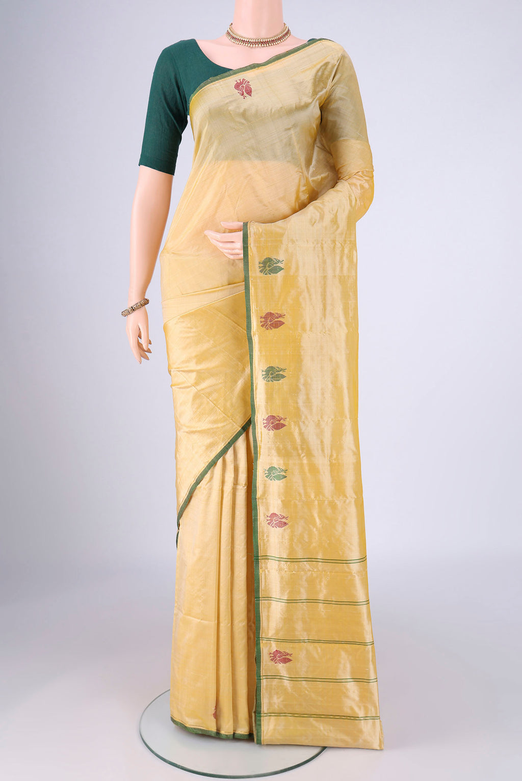 Sandal Kanchipuram Silk Saree with Plain Body and Zari And Thread Border.  displayed on a mannequin