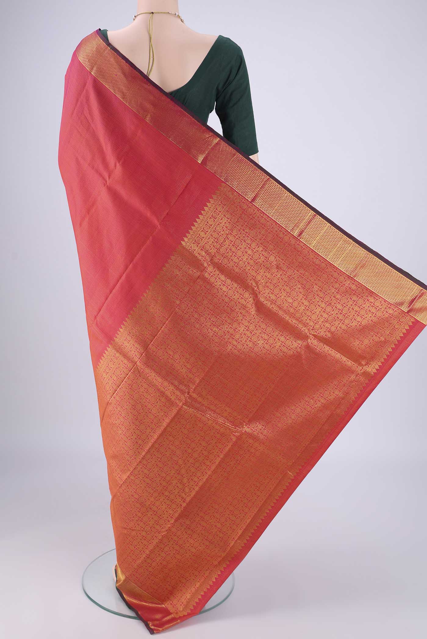 Flat view of Coral Dual Tone Kanjivaram Silk Saree with Stripes on the body and Zari Border. 