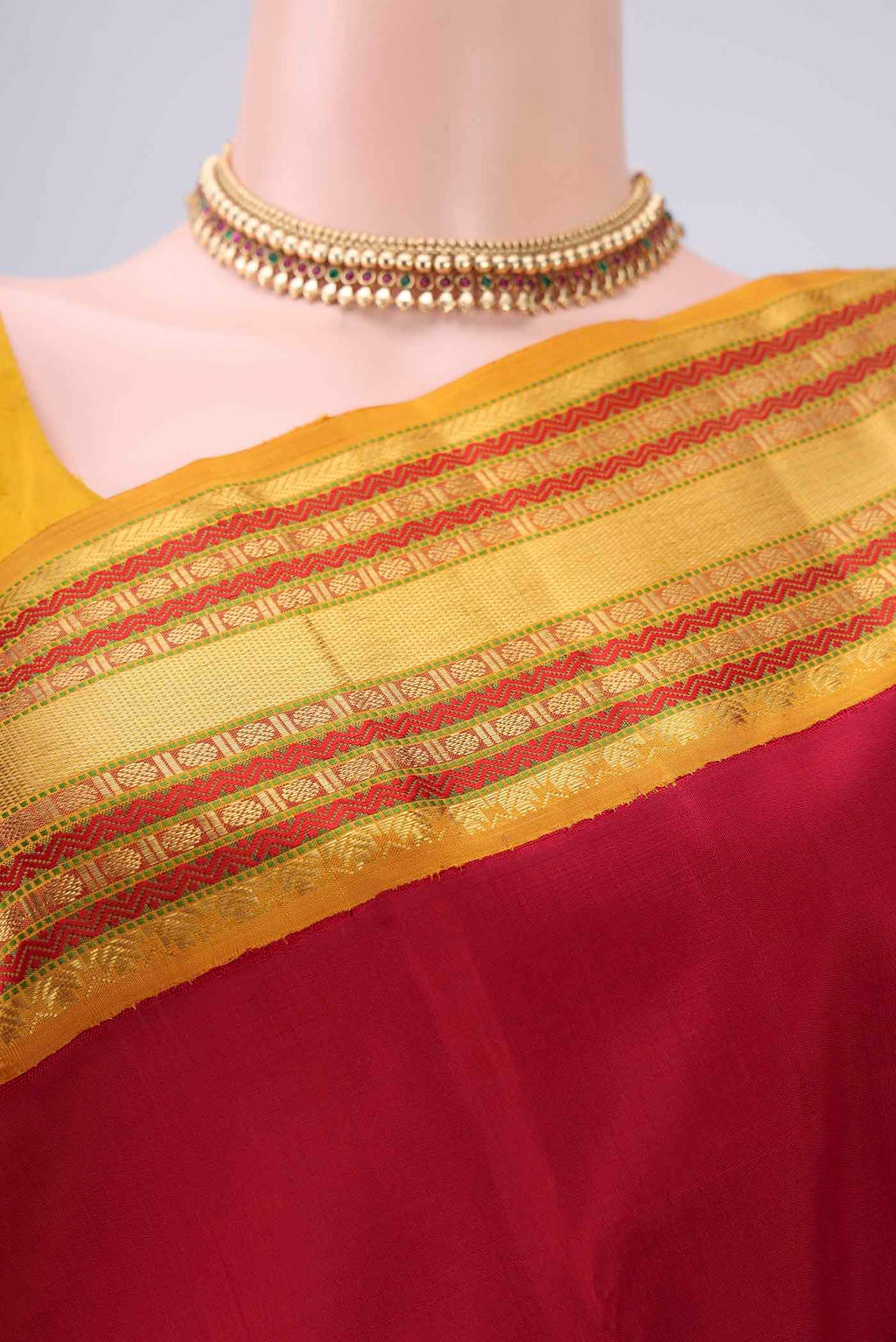 Border image of Pure Silk Pure Zari Maroon Kanjivaram Saree with Plain Body and Zari Border. 