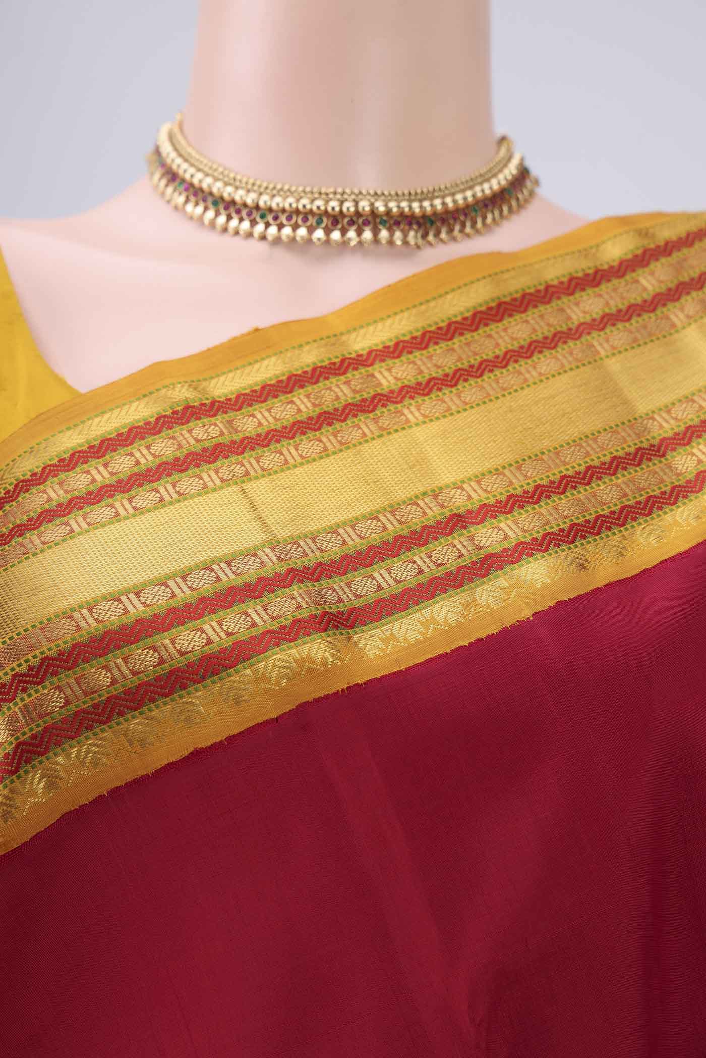 Border image of Pure Silk Pure Zari Maroon Kanjivaram Saree with Plain Body and Zari Border. 