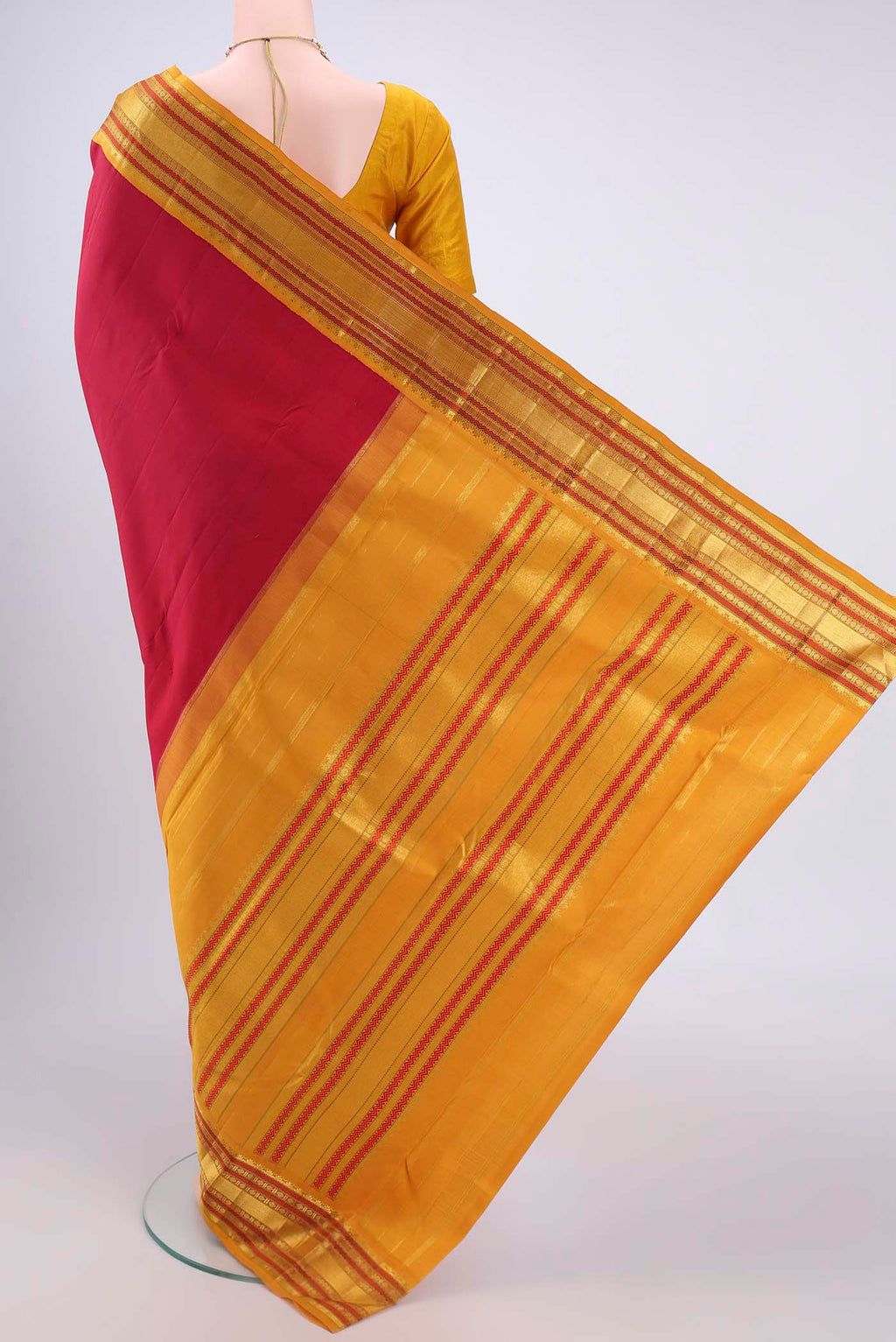 Flat view of Pure Silk Pure Zari Maroon Kanjivaram Saree with Plain Body and Zari Border. 
