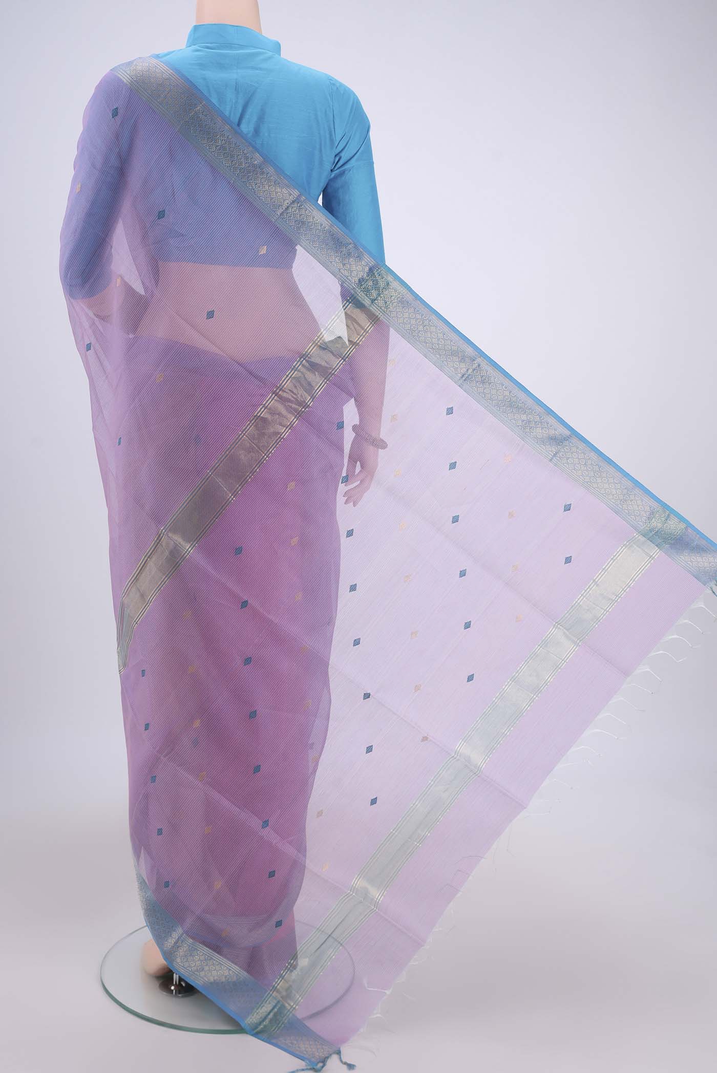 Flat view of Pink Maheshwari Silk Cotton Saree with Zari And Thread Butta on the body and Zari Border. 