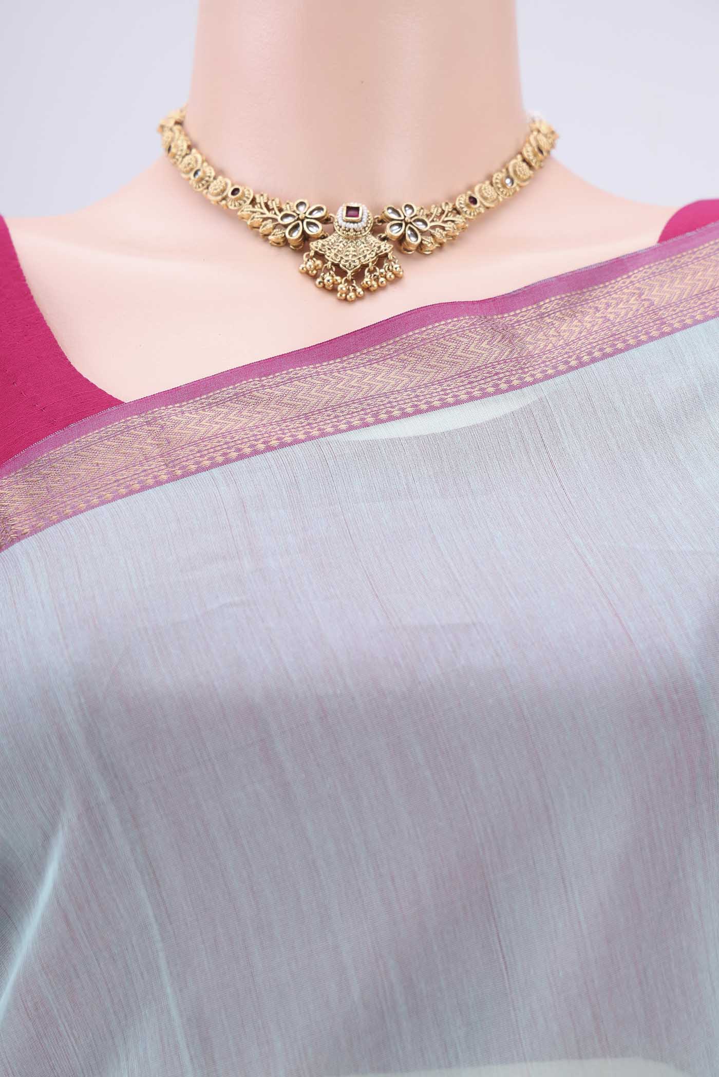 Border image of Turquoise Maheshwari Silk Cotton Saree with Zari Butta on the body and Zari Border. 