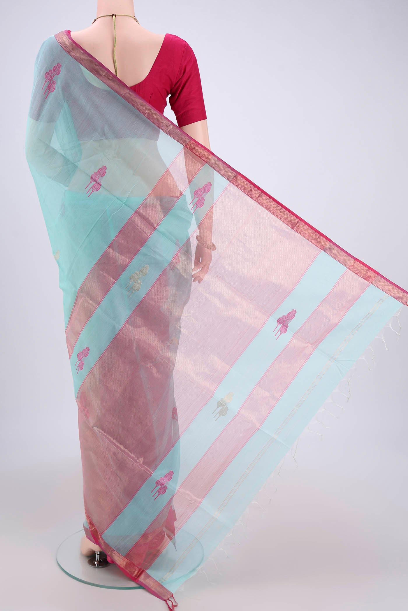 Flat view of Turquoise Maheshwari Silk Cotton Saree with Zari Butta on the body and Zari Border. 