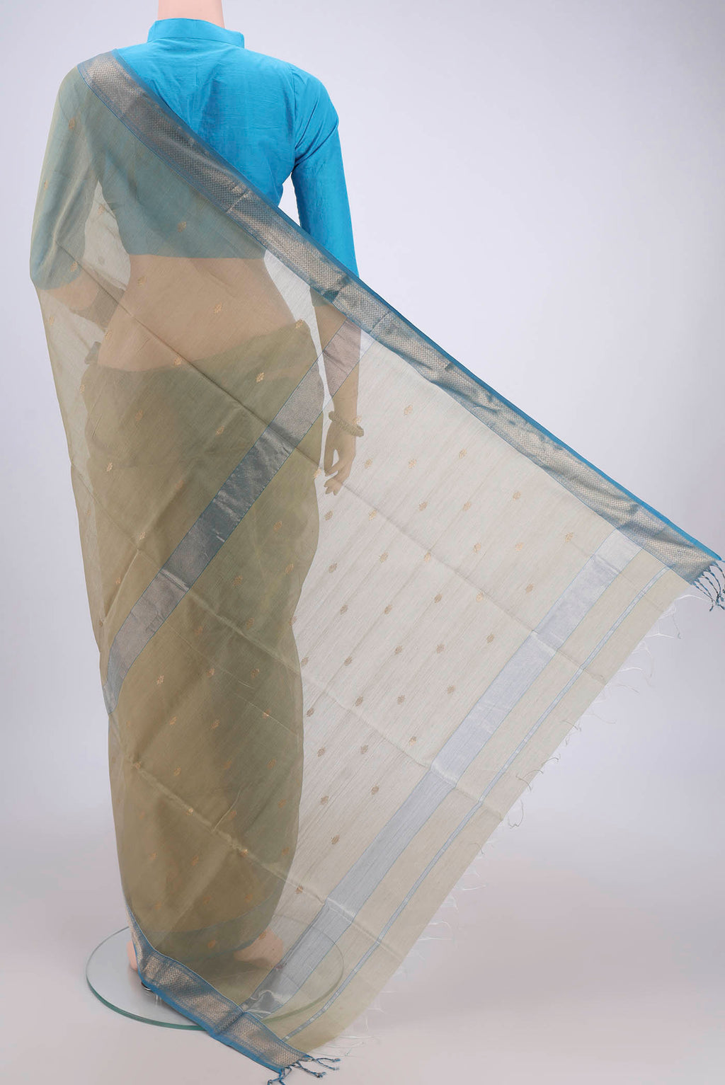 Flat view of Sage Green Maheshwari Silk Cotton Saree with Zari Butta on the body and Zari Border. 