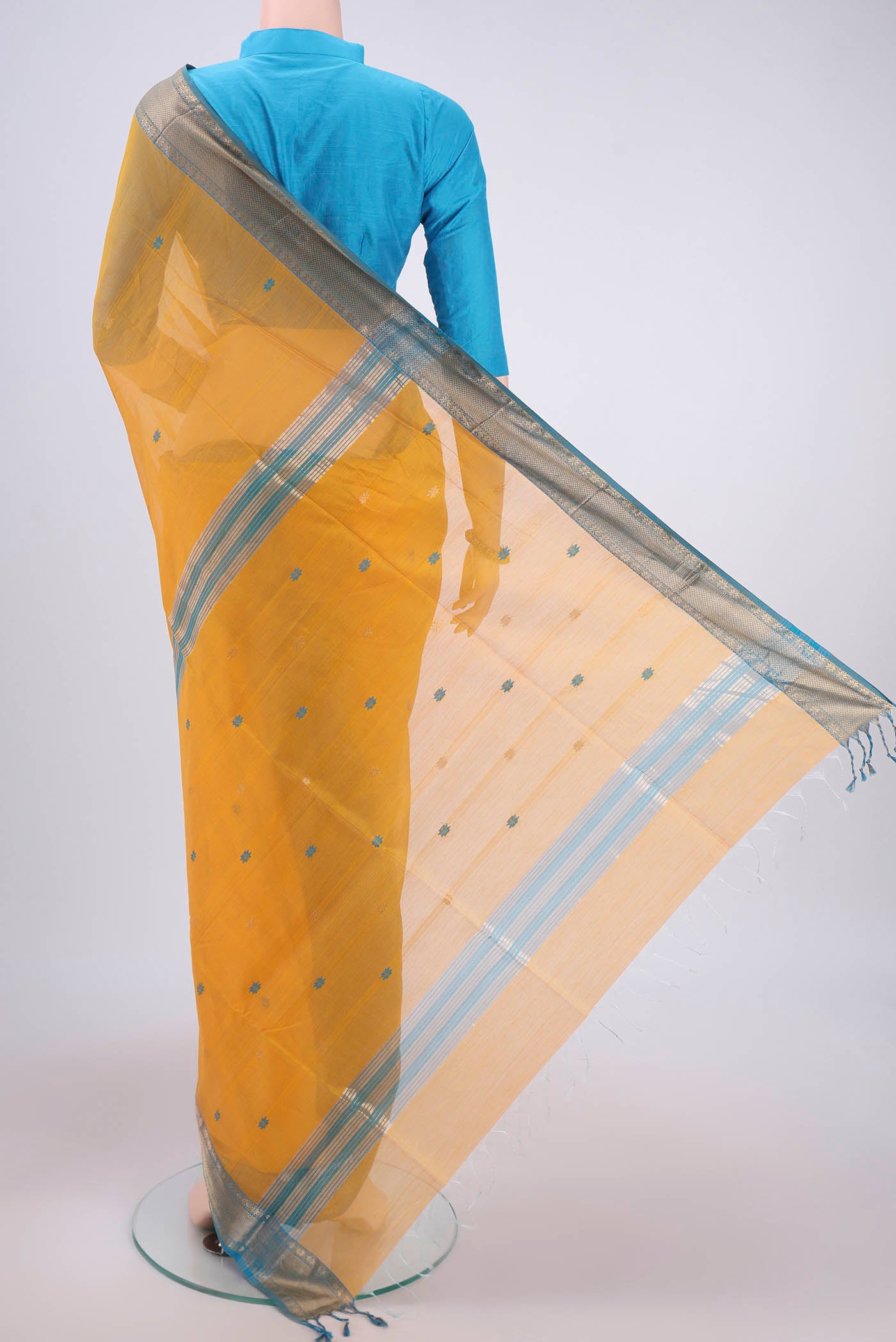Flat view of Yellow Maheshwari Silk Cotton Saree with Zari Butta on the body and Zari Border. 
