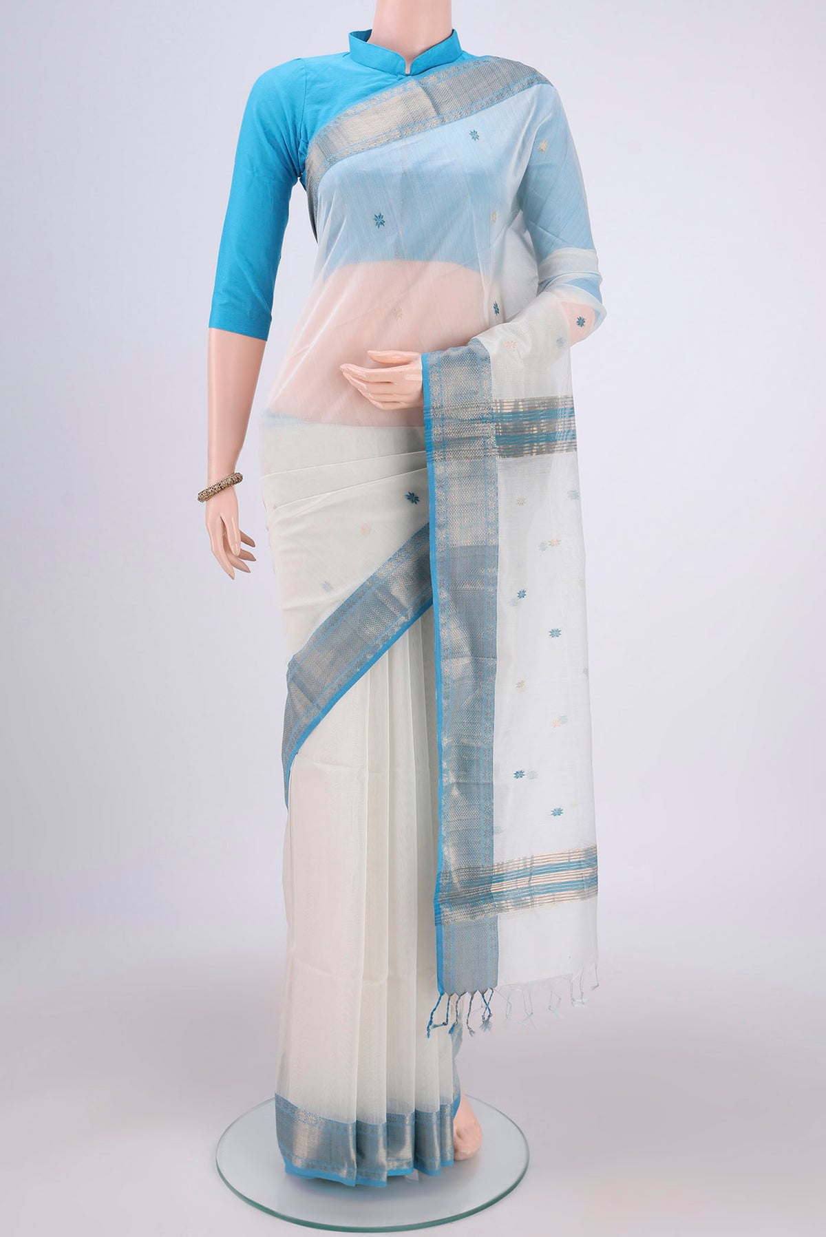 White Maheshwari Silk Cotton Saree with Plain Body and Zari Border.  displayed on a mannequin