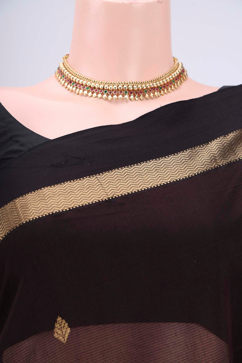 Border image of Brown Maheshwari Silk Cotton Saree with Zari Butta on the body and Zari Border. 