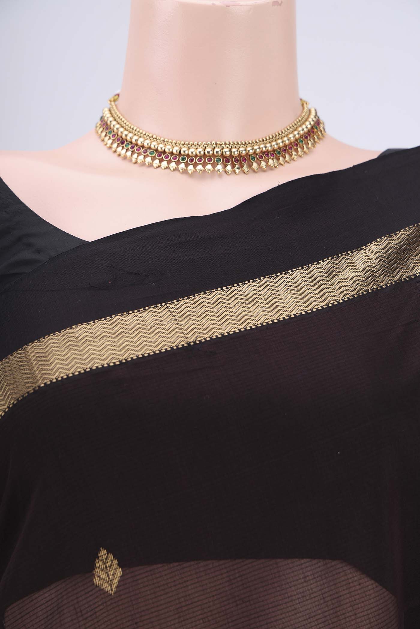 Border image of Brown Maheshwari Silk Cotton Saree with Zari Butta on the body and Zari Border. 