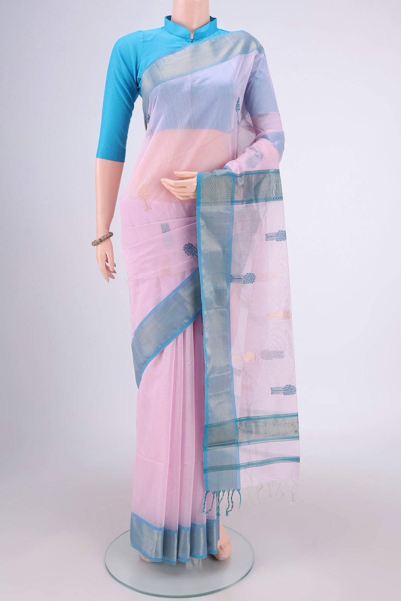 Rose pink Maheshwari Silk Cotton Saree with Zari And Thread Butta on the body and Zari Border.  displayed on a mannequin