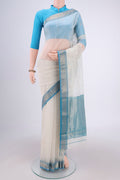 Off White Maheshwari Silk Cotton Saree with Zari Butta on the body and Zari Border.  displayed on a mannequin