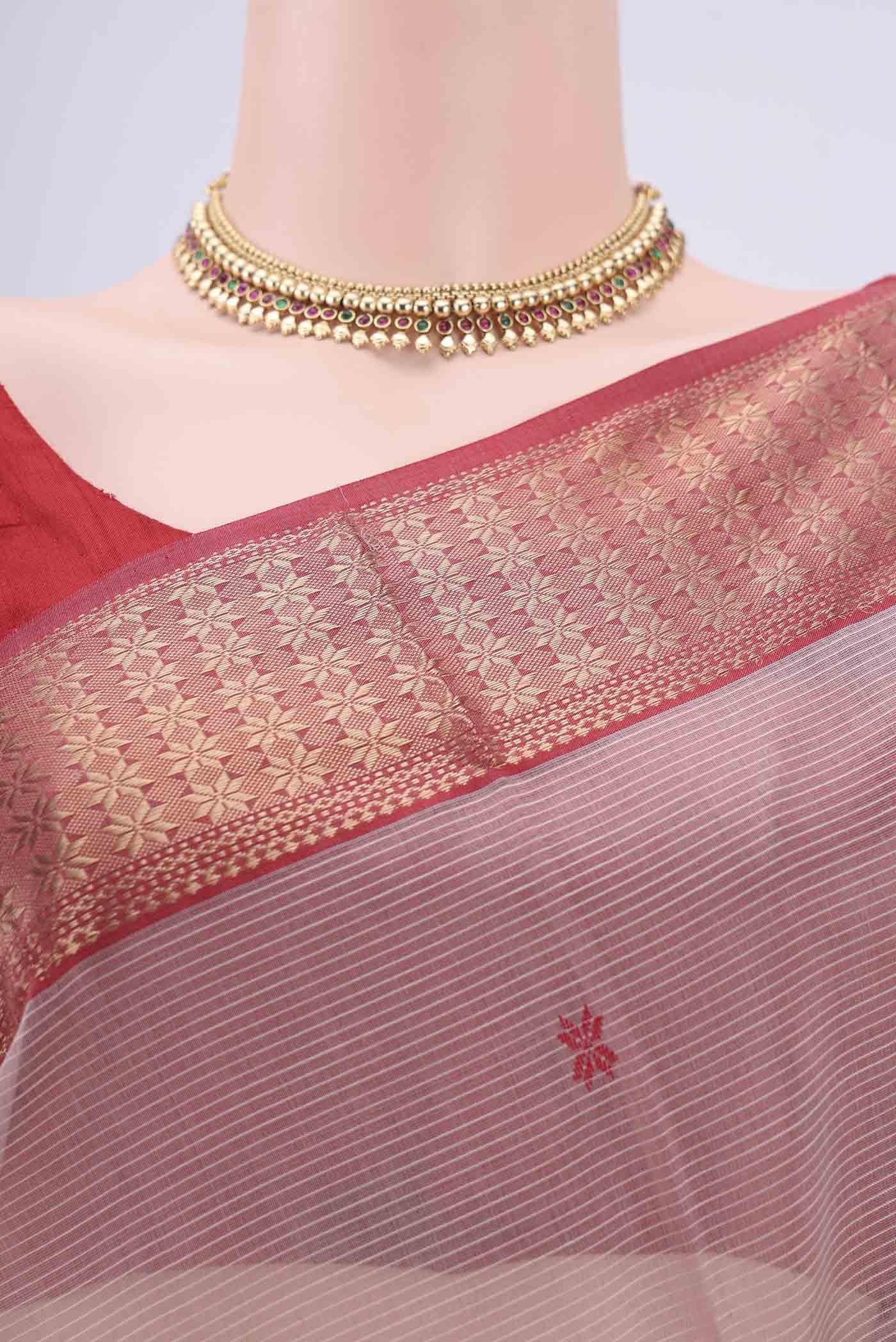 Border image of Coral Maheshwari Silk Cotton Saree with Zari Butta on the body and Zari Border. 