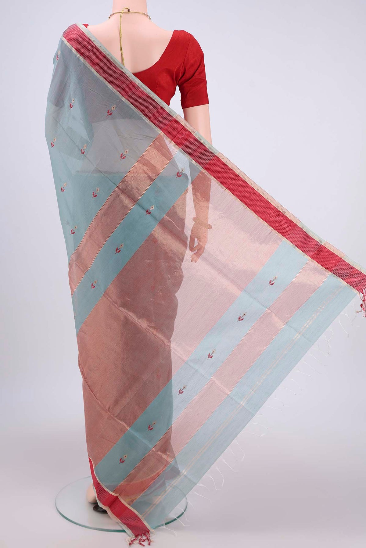 Flat view of Sage Green Maheshwari Silk Cotton Saree with Zari And Thread Butta on the body and Zari Border. 