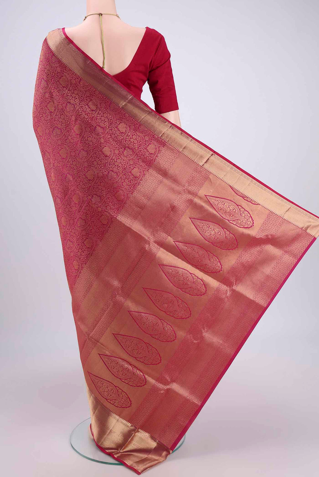 Flat view of Rani Pink Dual Tone Soft Silk Saree with Zari Brocade on the body and Zari Border. 