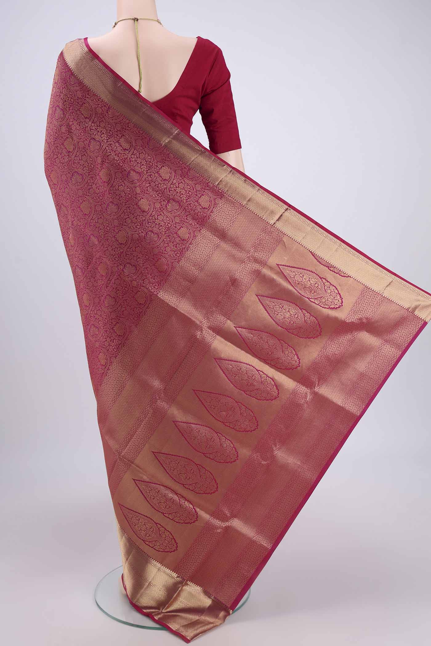 Flat view of Rani Pink Dual Tone Soft Silk Saree with Zari Brocade on the body and Zari Border. 