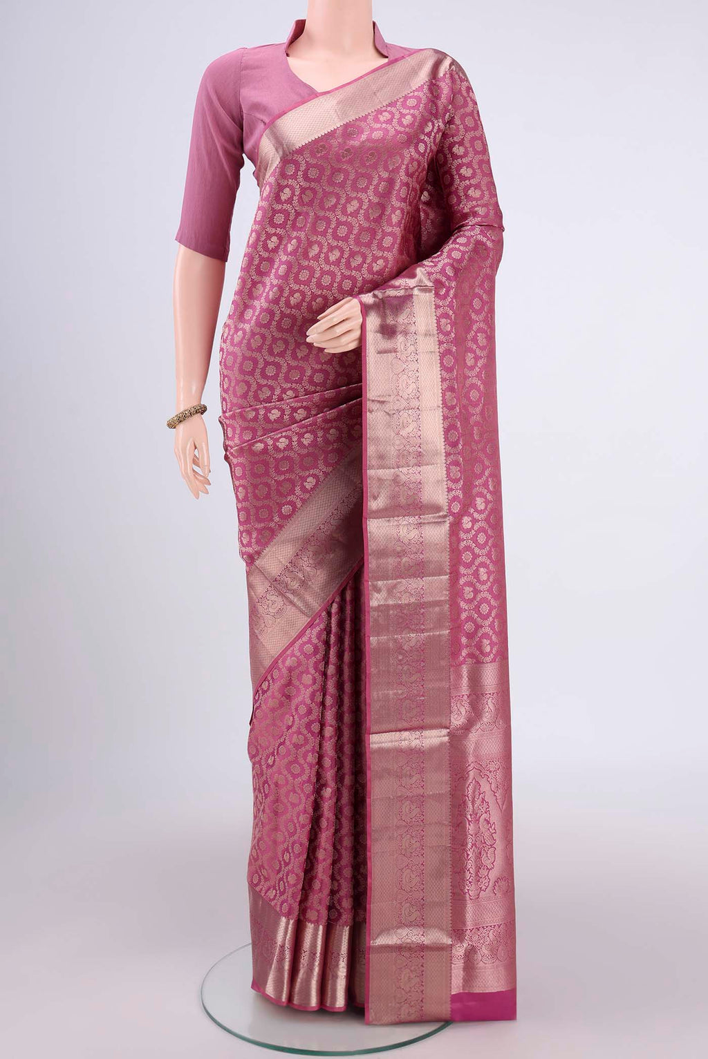 Rose Gold Dual Tone Soft Silk Saree with Zari Brocade on the body and Zari Border.  displayed on a mannequin
