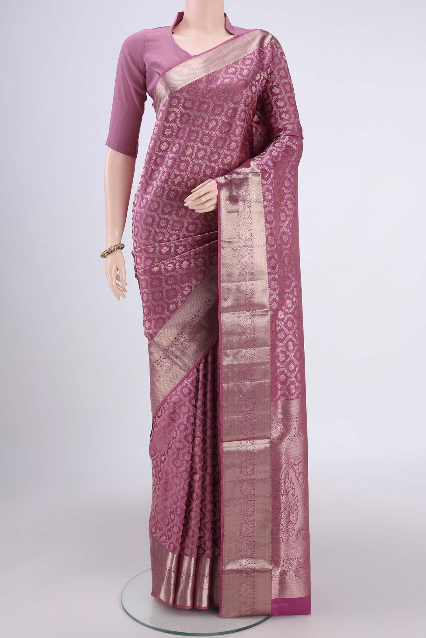 Rose Gold Dual Tone Soft Silk Saree with Zari Brocade on the body and Zari Border.  displayed on a mannequin