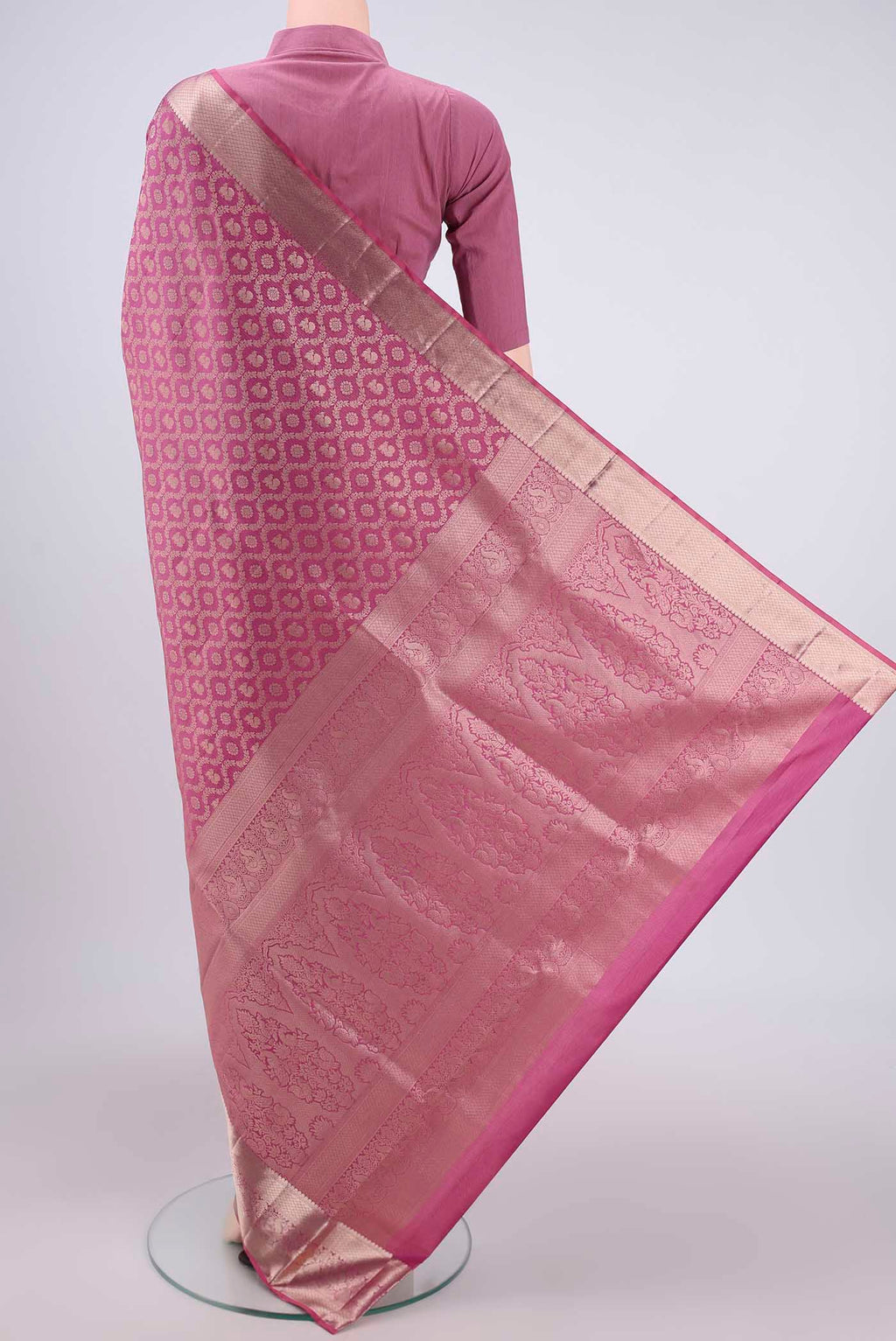 Flat view of Rose Gold Dual Tone Soft Silk Saree with Zari Brocade on the body and Zari Border. 